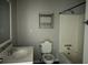 Bathroom featuring a shower-tub combo, toilet, and a vanity with sink at 6512 Executive Dr, Winston, GA 30187
