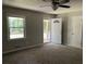 Comfortable bedroom with a window view, a ceiling fan, and a closet at 6512 Executive Dr, Winston, GA 30187