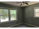 Bedroom with ceiling fan and two windows at 6512 Executive Dr, Winston, GA 30187