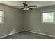 Bedroom with ceiling fan and two windows at 6512 Executive Dr, Winston, GA 30187