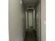 Neutral hallway featuring several doors at 6512 Executive Dr, Winston, GA 30187
