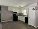 A well-lit kitchen with stainless steel appliances, ample cabinet space, and modern fixtures at 6512 Executive Dr, Winston, GA 30187