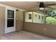 Cozy screened porch with a ceiling fan, offering a comfortable space to enjoy the outdoors bug-free at 6512 Executive Dr, Winston, GA 30187