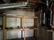 Unfinished basement includes shelving, painted floor and electrical panel at 730 Redlion Run, Alpharetta, GA 30022