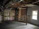 Unfinished basement with painted floor, utility access and natural light at 730 Redlion Run, Alpharetta, GA 30022