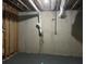 Unfinished basement showing exposed pipes and walls, presenting a blank canvas for customization at 730 Redlion Run, Alpharetta, GA 30022