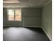 View of a spacious basement showcasing a large window that provides natural light, enhancing the area at 730 Redlion Run, Alpharetta, GA 30022