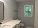 Modern bathroom with sleek vanity, black hardware, and neutral gray paint at 730 Redlion Run, Alpharetta, GA 30022