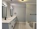 Bathroom with double sinks, modern fixtures, and a separate shower and jetted tub at 730 Redlion Run, Alpharetta, GA 30022