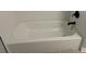 Clean, standard bathtub with sleek black fixtures and a bright tile surround at 730 Redlion Run, Alpharetta, GA 30022