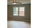 Bright bedroom featuring hardwood floors and a window with a neighborhood view at 730 Redlion Run, Alpharetta, GA 30022