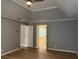 The primary bedroom has hardwood floors and provides access to the bathroom and closet at 730 Redlion Run, Alpharetta, GA 30022