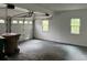 Spacious two car garage with windows and a white door perfect for parking and storage at 730 Redlion Run, Alpharetta, GA 30022