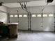 Spacious two car garage with white doors and updated garage door openers at 730 Redlion Run, Alpharetta, GA 30022
