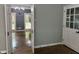 Bright living room featuring hardwood floors, gray walls, and large windows at 730 Redlion Run, Alpharetta, GA 30022