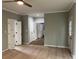 Spacious living room featuring neutral walls, hardwood floors and white trim at 730 Redlion Run, Alpharetta, GA 30022