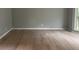 Spacious living room featuring light hardwood floors, neutral walls, and a bright, airy atmosphere at 730 Redlion Run, Alpharetta, GA 30022