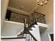 Elegant staircase featuring wood and iron railings, adding a touch of sophistication to the home at 730 Redlion Run, Alpharetta, GA 30022
