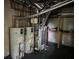 Basement utilities include water heaters, and a furnace, with shelving for storage at 730 Redlion Run, Alpharetta, GA 30022