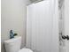 Clean bathroom featuring a white shower curtain and modern fixtures at 2040 Harvest Ridge Cir, Buford, GA 30519