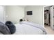 Neutral-toned bedroom featuring ample natural light, closet and TV at 2040 Harvest Ridge Cir, Buford, GA 30519