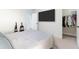Cozy bedroom with closet storage, light carpet, and access to another room at 2040 Harvest Ridge Cir, Buford, GA 30519