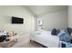 Comfortable bedroom with neutral decor, a window, a TV, and a cozy bed at 2040 Harvest Ridge Cir, Buford, GA 30519