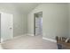 Neutral-toned bedroom featuring ample natural light, and a doorway to another room at 2040 Harvest Ridge Cir, Buford, GA 30519