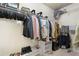 Walk-in closet featuring ample hanging space and shelving for organization and storage at 2040 Harvest Ridge Cir, Buford, GA 30519