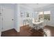 Dining room featuring modern chandelier, and a white table with seating for six at 2040 Harvest Ridge Cir, Buford, GA 30519
