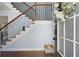 Light filled entryway featuring a staircase with wood and iron accents and wood flooring at 2040 Harvest Ridge Cir, Buford, GA 30519