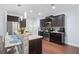 Modern kitchen with granite countertops, stainless steel appliances, and breakfast bar seating at 2040 Harvest Ridge Cir, Buford, GA 30519