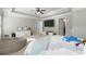 Bright, spacious main bedroom with a trey ceiling, soft colors, and comfortable seating at 2040 Harvest Ridge Cir, Buford, GA 30519