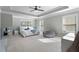 Spacious main bedroom with a trey ceiling, soft colors, and comfortable seating at 2040 Harvest Ridge Cir, Buford, GA 30519