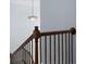 Staircase with wooden banister and iron spindles leading to the upper level at 2040 Harvest Ridge Cir, Buford, GA 30519