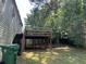 View of a wooden deck and lush backyard; a great place for entertaining and relaxing outdoors at 2317 Wilkins Ct, Decatur, GA 30035