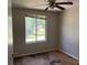 A basic bedroom with a window shows signs of needing TLC at 2317 Wilkins Ct, Decatur, GA 30035