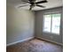 A basic bedroom with a window and ceiling fan offers a simple canvas for personalization at 2317 Wilkins Ct, Decatur, GA 30035