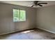 A basic bedroom with a window and ceiling fan offers a simple canvas for personalization at 2317 Wilkins Ct, Decatur, GA 30035