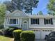 Charming two-story home with landscaped front yard and attached two-car garage at 2317 Wilkins Ct, Decatur, GA 30035