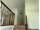 A foyer with stairs and hardwood railings needing some TLC and renovations at 2317 Wilkins Ct, Decatur, GA 30035