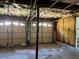 Incomplete garage space with two garage doors and insulation on the walls awaiting full renovation or buildout at 2317 Wilkins Ct, Decatur, GA 30035