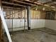 Partially finished garage interior, revealing exposed ceiling beams and a rough concrete floor at 2317 Wilkins Ct, Decatur, GA 30035