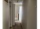 Narrow hallway with doorways needing renovation at 2317 Wilkins Ct, Decatur, GA 30035