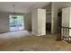 Open floor plan with exposed studs ready for renovation at 2317 Wilkins Ct, Decatur, GA 30035