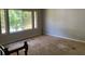 Spacious living area with large windows and hardwood floors ready for renovation at 2317 Wilkins Ct, Decatur, GA 30035
