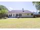 Expansive backyard featuring a well-maintained lawn, patio, and charming landscaping at 2780 Matlin Way, Buford, GA 30519