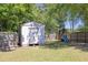 Fenced backyard with a storage shed, swing set and plenty of room to play at 2780 Matlin Way, Buford, GA 30519