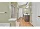 Bathroom featuring a shower, a vanity sink, and modern lighting at 2780 Matlin Way, Buford, GA 30519