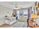 Cozy bedroom featuring a daybed, soft lighting, and a charming decor with ample natural light at 2780 Matlin Way, Buford, GA 30519